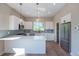 Well-lit kitchen featuring quartz counters, stainless steel appliances, and ample cabinet space at 8500 W 62Nd Ave # D, Arvada, CO 80004