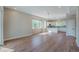 Bright and airy living room with hardwood floors, large windows, and open layout to the kitchen at 8500 W 62Nd Ave # D, Arvada, CO 80004