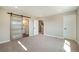 Bright main bedroom featuring a barn door to the bathroom, and ample natural light at 8500 W 62Nd Ave # D, Arvada, CO 80004