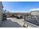 Spacious roof deck with outdoor seating and scenic views of the mountains and neighborhood at 8500 W 62Nd Ave # D, Arvada, CO 80004