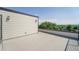 Exterior shot of rooftop patio with railing and view of treeline at 8500 W 62Nd Ave # D, Arvada, CO 80004