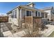View of the home featuring a wooden deck and concrete patio, ideal for entertaining at 24704 E Chenango Dr, Aurora, CO 80016