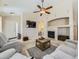 Comfortable living room featuring a fireplace, large TV, and open layout for easy flow at 24704 E Chenango Dr, Aurora, CO 80016