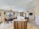 Open concept living room with dining area adjacent to kitchen, creating an inviting space at 24704 E Chenango Dr, Aurora, CO 80016