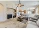 Inviting living room with a cozy fireplace, plush sofas, and neutral decor at 24704 E Chenango Dr, Aurora, CO 80016
