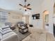 Spacious living room with plush carpeting, a ceiling fan, and abundant natural light at 24704 E Chenango Dr, Aurora, CO 80016