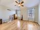 Spacious main bedroom with hardwood floors, ceiling fan, and plenty of natural light at 24704 E Chenango Dr, Aurora, CO 80016