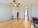 Airy main bedroom with hardwood floors, ceiling fan, and ensuite bathroom at 24704 E Chenango Dr, Aurora, CO 80016