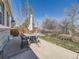 The concrete patio features a table with umbrella and a seating area, perfect for outdoor gatherings at 24704 E Chenango Dr, Aurora, CO 80016