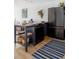 Cozy kitchen with modern appliances and a rustic center island at 1050 N Corona St # 312, Denver, CO 80218
