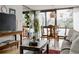 Cozy living room with lots of light, wood accents, and beautiful views of the outdoors at 1050 N Corona St # 312, Denver, CO 80218