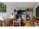 Cozy living room with an open layout connecting to the modern kitchen at 1050 N Corona St # 312, Denver, CO 80218