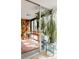 Bright sunroom with lots of natural light, shelves, and plants at 1050 N Corona St # 312, Denver, CO 80218
