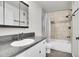 Clean bathroom, featuring a shower/tub combo and updated vanity at 11127 Alcott St # A, Denver, CO 80234