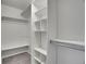 Walk-in closet with built-in shelves and hanging rods at 11127 Alcott St # A, Denver, CO 80234