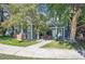 Charming townhome with welcoming front porch and mature trees at 11127 Alcott St # A, Denver, CO 80234