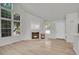 Bright living room features a fireplace and vaulted ceilings at 11127 Alcott St # A, Denver, CO 80234