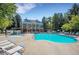 Community pool with lounge chairs and a hot tub at 11127 Alcott St # A, Denver, CO 80234