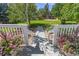 Backyard view featuring a garden, lush greenery, and flower-lined steps at 6258 Lancaster Ave, Castle Rock, CO 80104