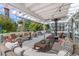 Outdoor deck with comfortable seating, dining area, and views of the lush backyard at 6258 Lancaster Ave, Castle Rock, CO 80104