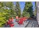 A backyard patio features a fire pit circled by comfortable Adirondack chairs, inviting gatherings outdoors at 6258 Lancaster Ave, Castle Rock, CO 80104