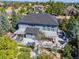 Aerial view of an expansive deck with lounge furniture, barbecue, and a pergola, perfect for outdoor entertaining at 6258 Lancaster Ave, Castle Rock, CO 80104