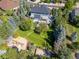 Expansive backyard featuring lush lawn, mature trees, playset, and an inviting deck, perfect for outdoor living at 6258 Lancaster Ave, Castle Rock, CO 80104