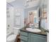 Bathroom featuring blue cabinets and granite countertop at 6258 Lancaster Ave, Castle Rock, CO 80104