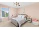 Bedroom with a ceiling fan and large window with a window view at 6258 Lancaster Ave, Castle Rock, CO 80104