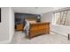 Charming bedroom featuring a wooden bed frame, bedside tables, and a window with a view at 6258 Lancaster Ave, Castle Rock, CO 80104