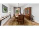 Elegant dining room features hardwood floors, a stylish rug, dining table set and a beautiful chandelier at 6258 Lancaster Ave, Castle Rock, CO 80104