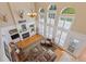 Top down view of living room with fireplace, high ceilings and ample natural light from many windows at 6258 Lancaster Ave, Castle Rock, CO 80104