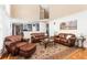 Spacious living room showcasing hardwood floors, stylish furniture, and abundant natural light at 6258 Lancaster Ave, Castle Rock, CO 80104