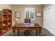 Home office featuring a large desk, built-in shelving, and natural light at 6258 Lancaster Ave, Castle Rock, CO 80104