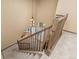 Open staircase leading to entryway featuring hardwood floors, light walls, and chandelier at 6258 Lancaster Ave, Castle Rock, CO 80104