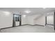 Basement featuring neutral carpeting, a window, and ample room for various activities at 5604 Singletree Ln, Parker, CO 80134