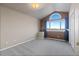 Bedroom with vaulted ceilings, large window providing natural light, and neutral-toned walls at 5604 Singletree Ln, Parker, CO 80134
