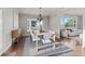 Bright dining room features a modern table and chairs with windows and a view at 5604 Singletree Ln, Parker, CO 80134
