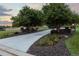 Well-maintained driveway leads to the home, lined with manicured landscaping at 5604 Singletree Ln, Parker, CO 80134