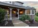 Charming front porch with brick accents and decorative plants welcomes visitors at 5604 Singletree Ln, Parker, CO 80134