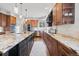 Stylish kitchen showcasing a large island, granite countertops, modern appliances and updated cabinetry at 5604 Singletree Ln, Parker, CO 80134