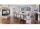 Living room features a stone fireplace and modern decor for a comfortable space at 5604 Singletree Ln, Parker, CO 80134