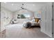 Spacious main bedroom with vaulted ceiling, large window, and private deck access at 5604 Singletree Ln, Parker, CO 80134