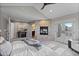Comfortable main bedroom with a stone fireplace and access to a private deck at 5604 Singletree Ln, Parker, CO 80134