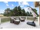 Relaxing outdoor deck featuring comfortable seating and peaceful treetop views at 5604 Singletree Ln, Parker, CO 80134