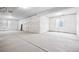 Unfinished basement with concrete floors, wrapped walls, and natural light from window wells at 16634 W 93Rd Way, Arvada, CO 80007