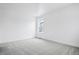 Bright bedroom with carpeted floors and white walls at 16634 W 93Rd Way, Arvada, CO 80007