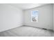 Neutral bedroom with carpeted floors and white walls at 16634 W 93Rd Way, Arvada, CO 80007