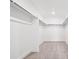 Spacious walk-in closet with ample hanging space and neutral carpeting at 16634 W 93Rd Way, Arvada, CO 80007