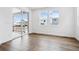 Bright living room with wood floors and sliding glass doors to the outdoor patio at 16634 W 93Rd Way, Arvada, CO 80007